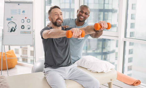 Patient doing guided shoulder exercises